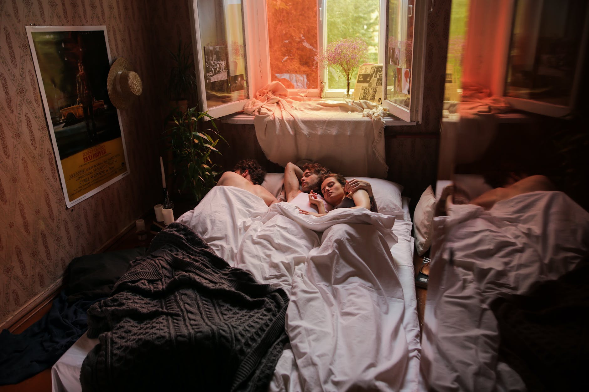 woman in white shirt lying on bed